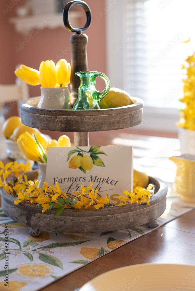 Tiered tray decorated in yellow for Spring